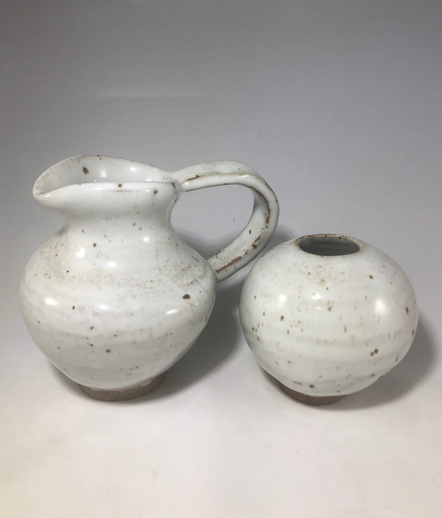 White pitcher and vase