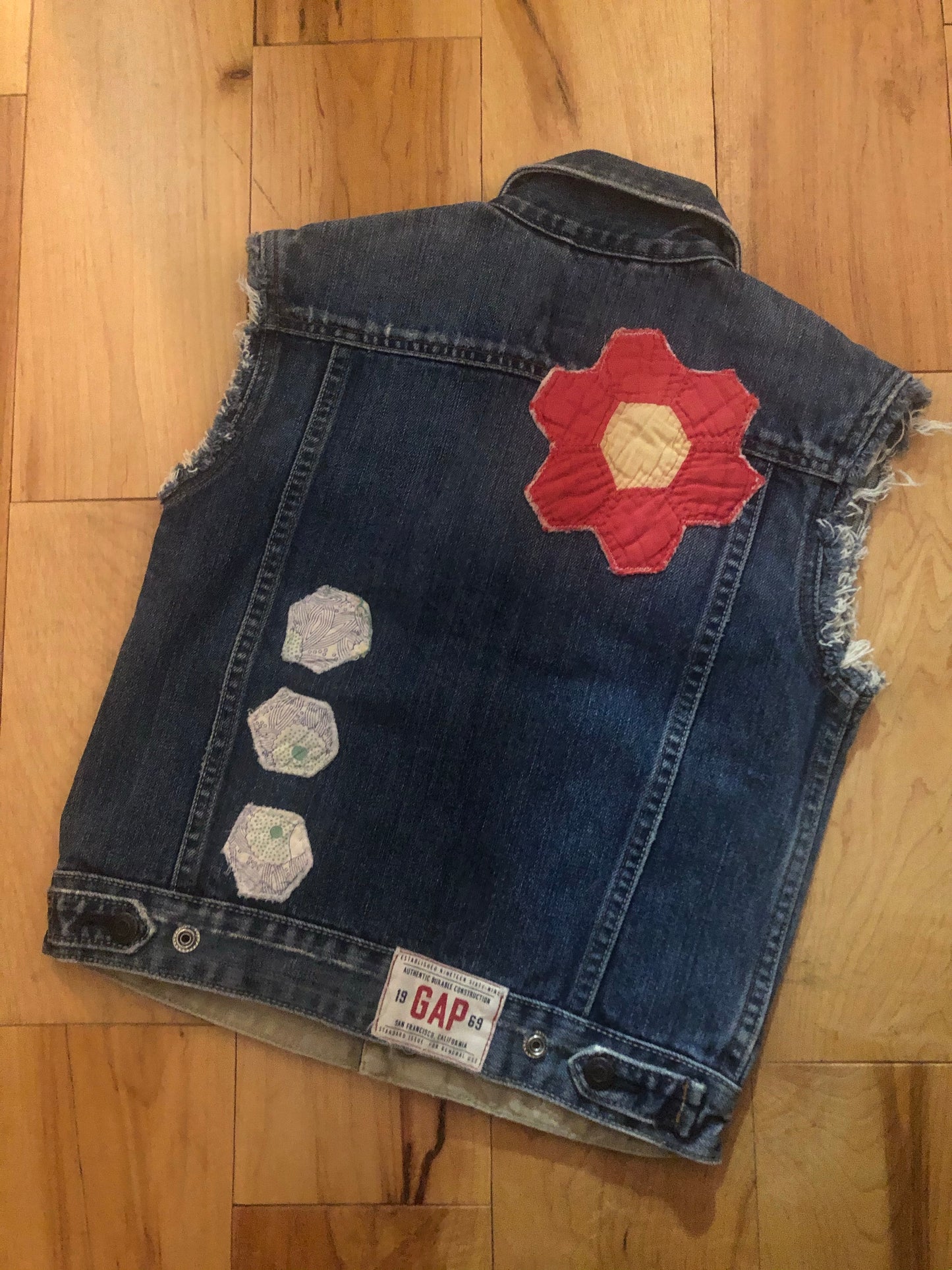 backside of kids denim jacket with stitched designs
