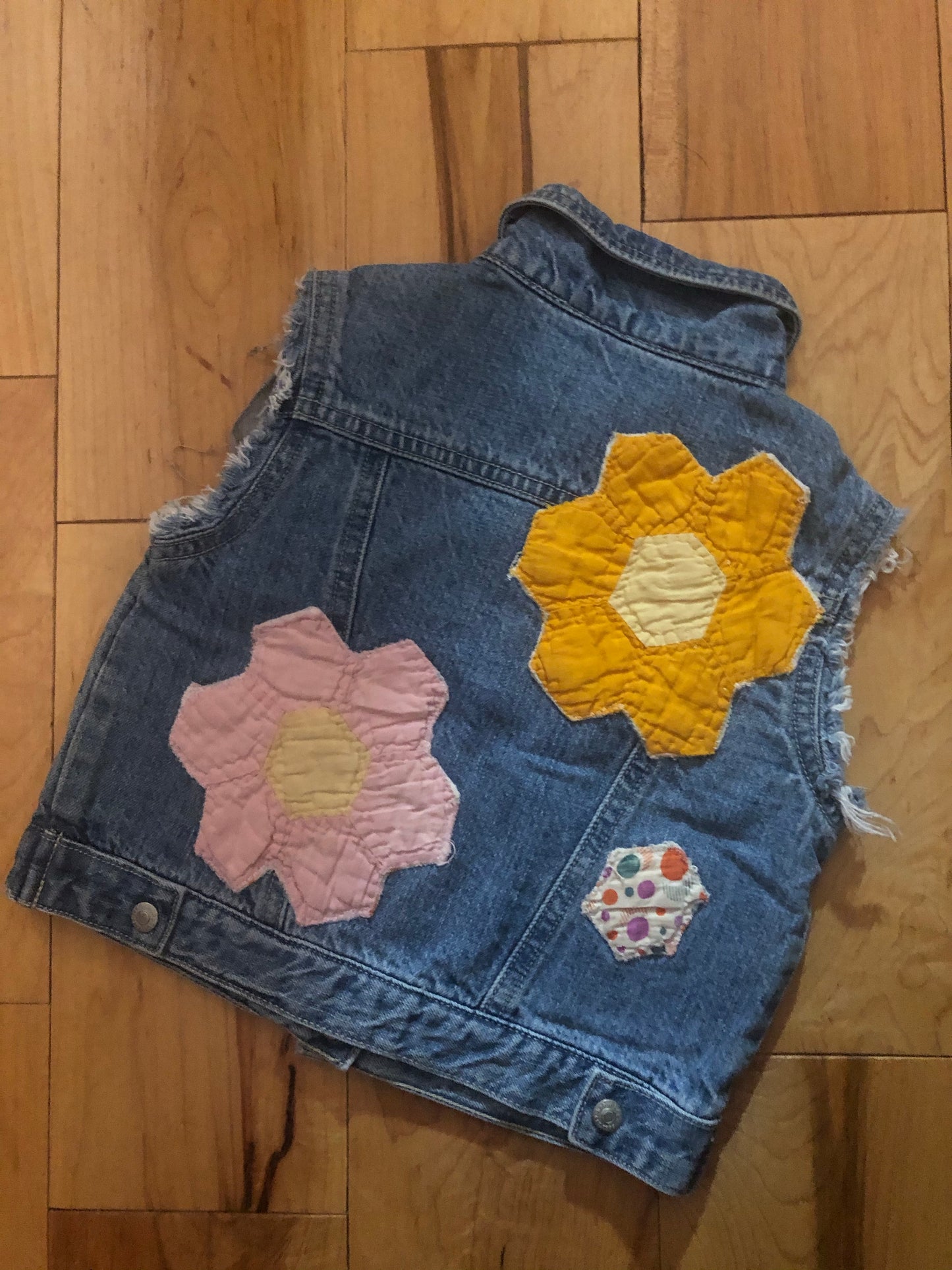 toddler denim vest with hand-sewn flowers